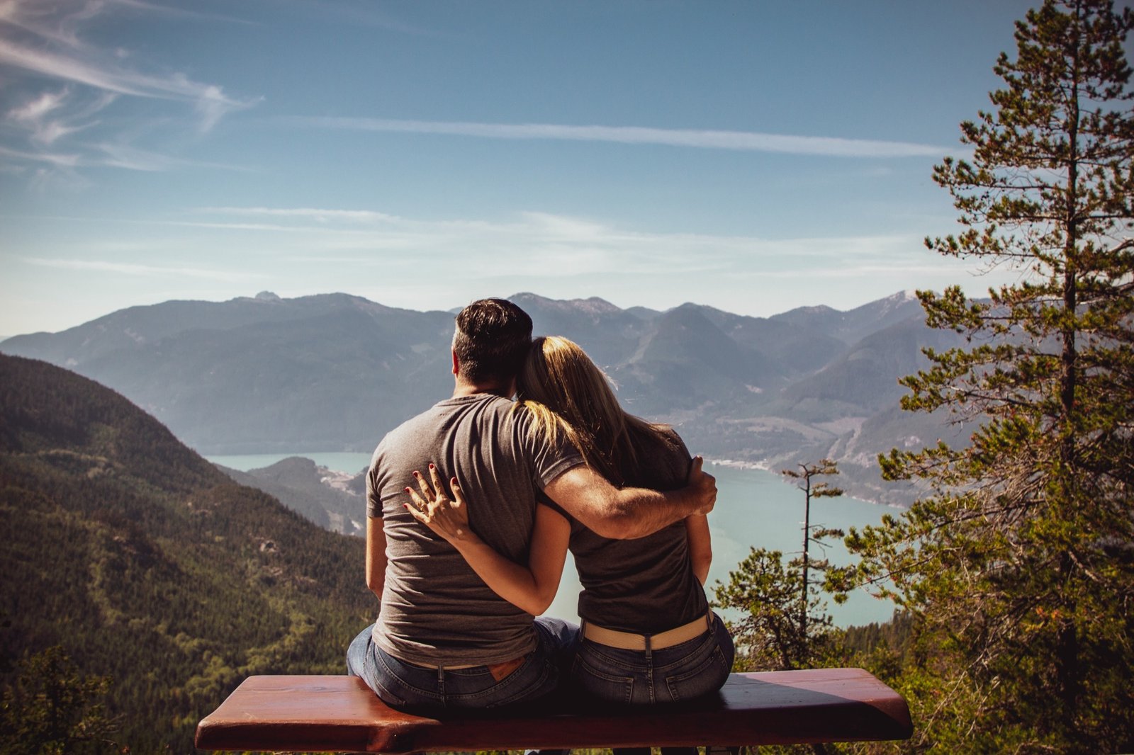 A couple looking toward a mountain horizon together