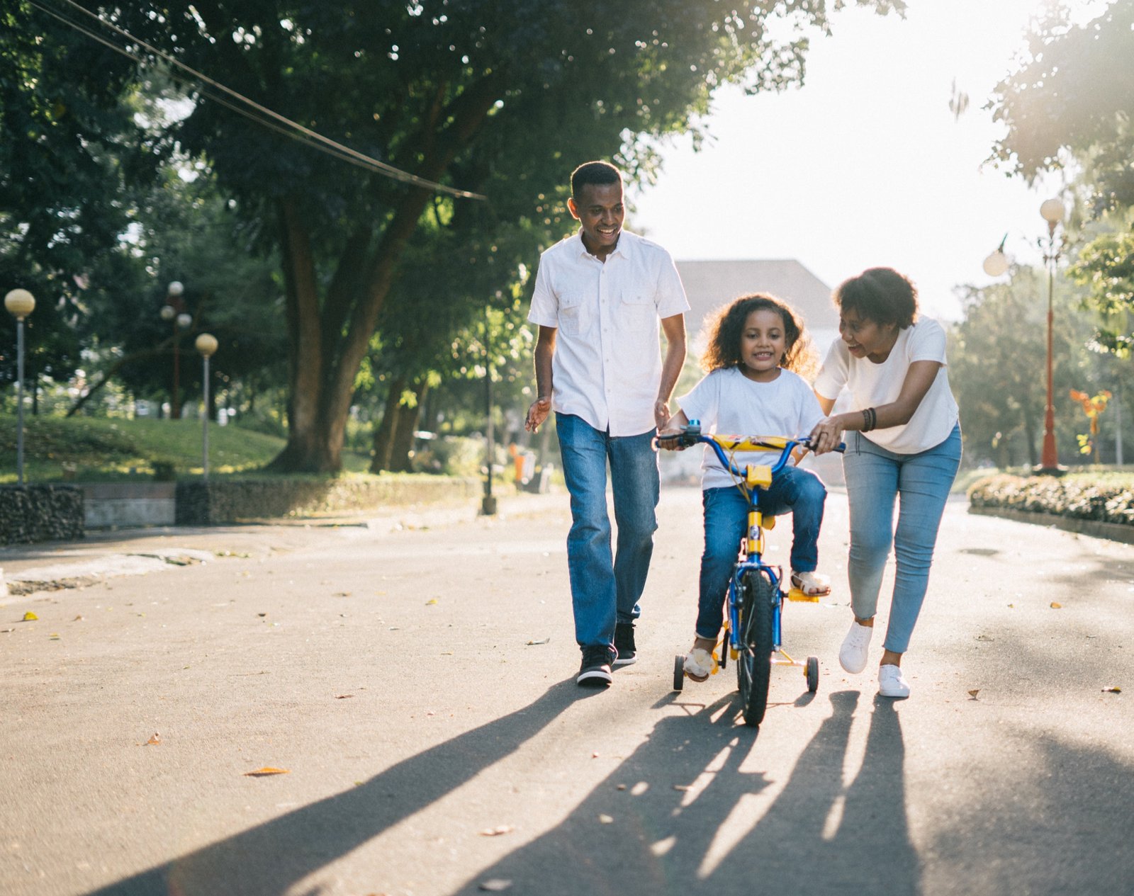 A family enjoying a sunny bike ride together